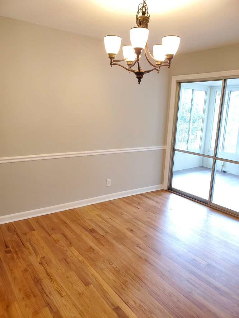 6311 Gable Avenue Columbus, GA 31909 - Photo 11 of 27 wooden floor in an empty room with a window
