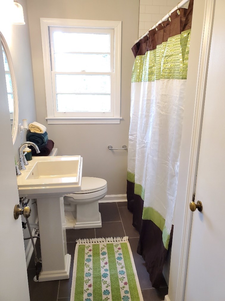 6311 Gable Avenue Columbus, GA 31909 - Photo 19 of 27 a bathroom with a sink and a mirror