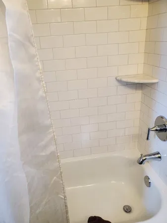 a bathroom with a sink toilet and window