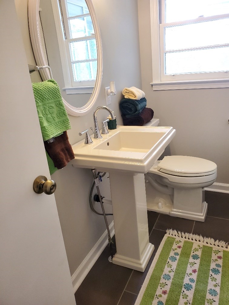 6311 Gable Avenue Columbus, GA 31909 - Photo 21 of 27 a bathroom with a sink toilet and window