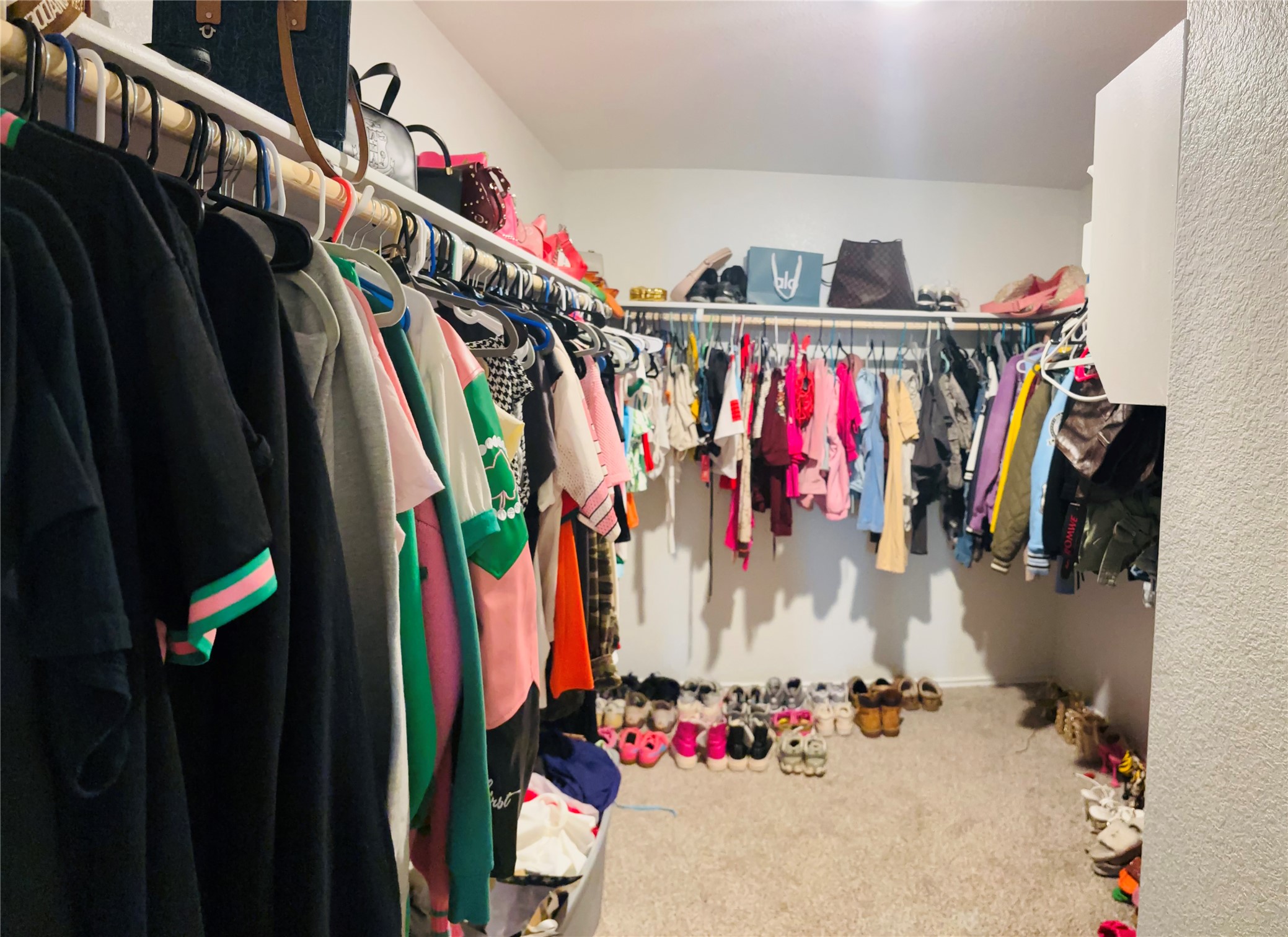 14817 Perlino Way, Unit A Manor, TX 78653 - Photo 20 of 40 a view of walk in closet with clothes