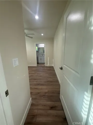 a view of gallery with wooden floor