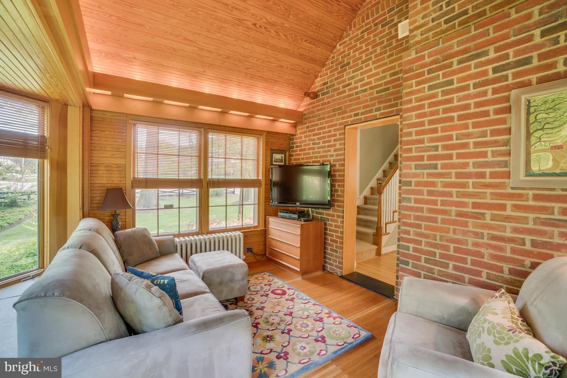 3909 Franconia Road Alexandria, VA 22310 - Photo 17 of 35 lots of windows, vaulted ceiling and brick walls.