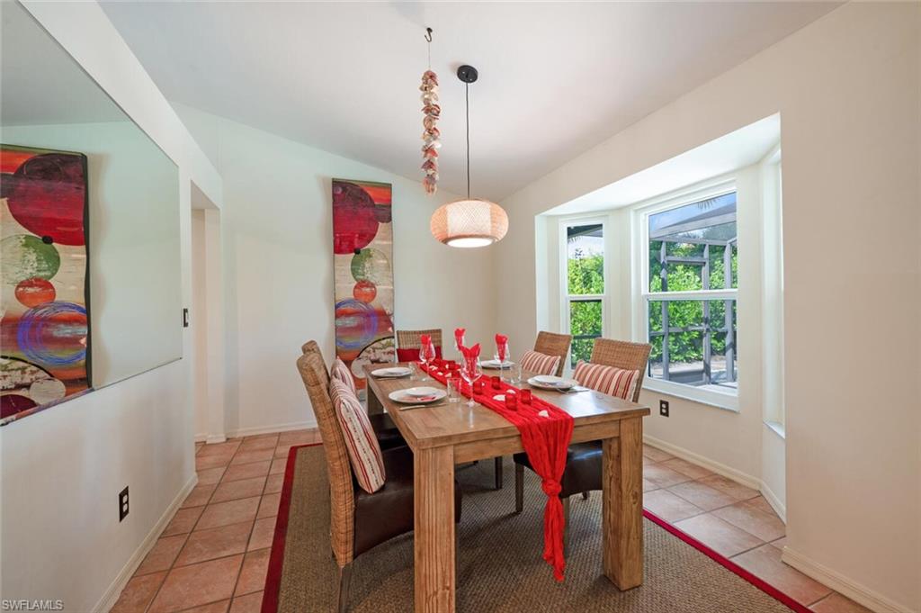 229 Countryside Drive Naples, FL 34104 - Photo 13 of 44 a view of a dining room with furniture window and outside view