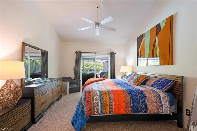 a bedroom with bed and wooden floor