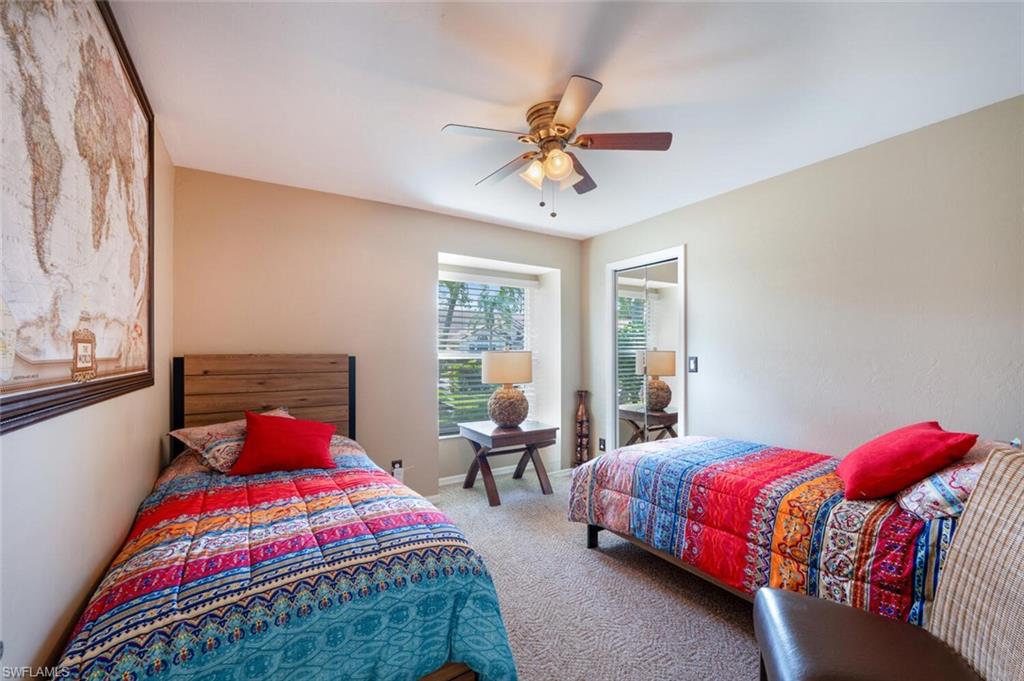 229 Countryside Drive Naples, FL 34104 - Photo 22 of 44 a bedroom with a bed and window