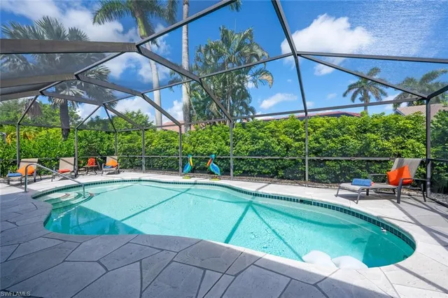 a view of a swimming pool with a patio