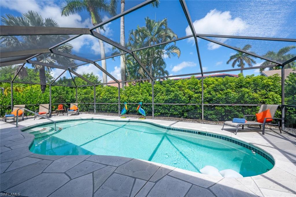 229 Countryside Drive Naples, FL 34104 - Photo 26 of 44 a view of a backyard with swimming pool and sitting area