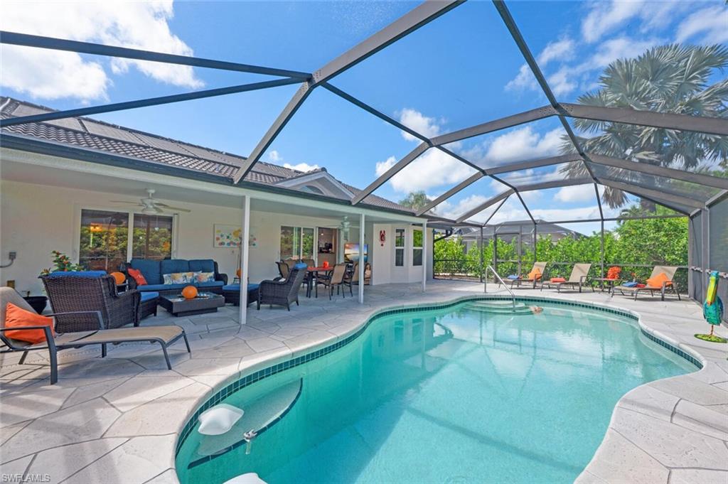 229 Countryside Drive Naples, FL 34104 - Photo 27 of 44 a view of a swimming pool with a patio