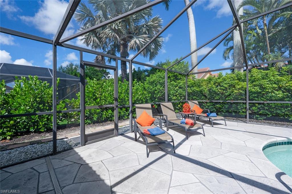229 Countryside Drive Naples, FL 34104 - Photo 34 of 44 a garden view with a seating space