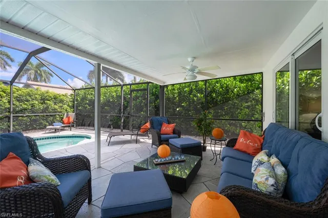 an aerial view of lake and residential houses with outdoor space