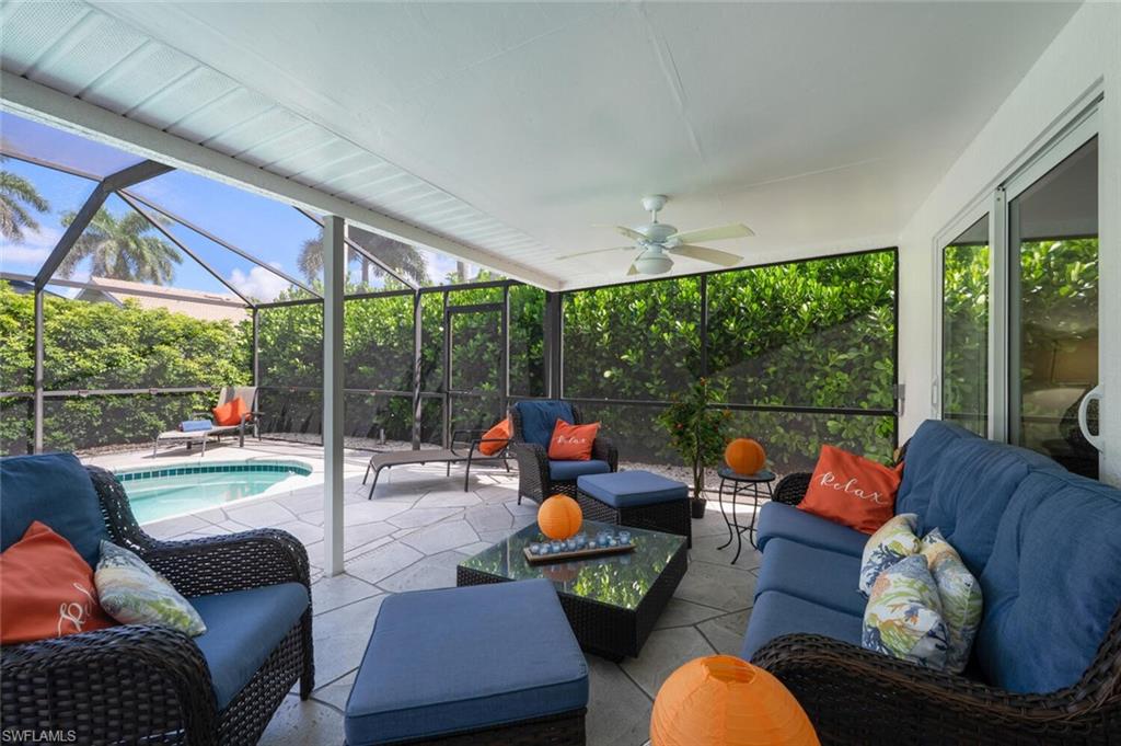 229 Countryside Drive Naples, FL 34104 - Photo 36 of 44 a living room with furniture and a large window