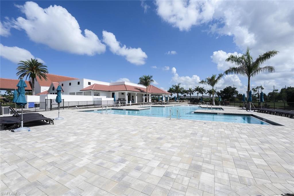 229 Countryside Drive Naples, FL 34104 - Photo 40 of 44 a view of swimming pool with outdoor seating and a patio