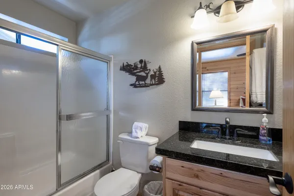 a bedroom with bed and a window