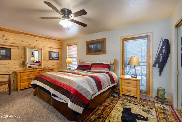 a view of a hallway with workspace and mirror
