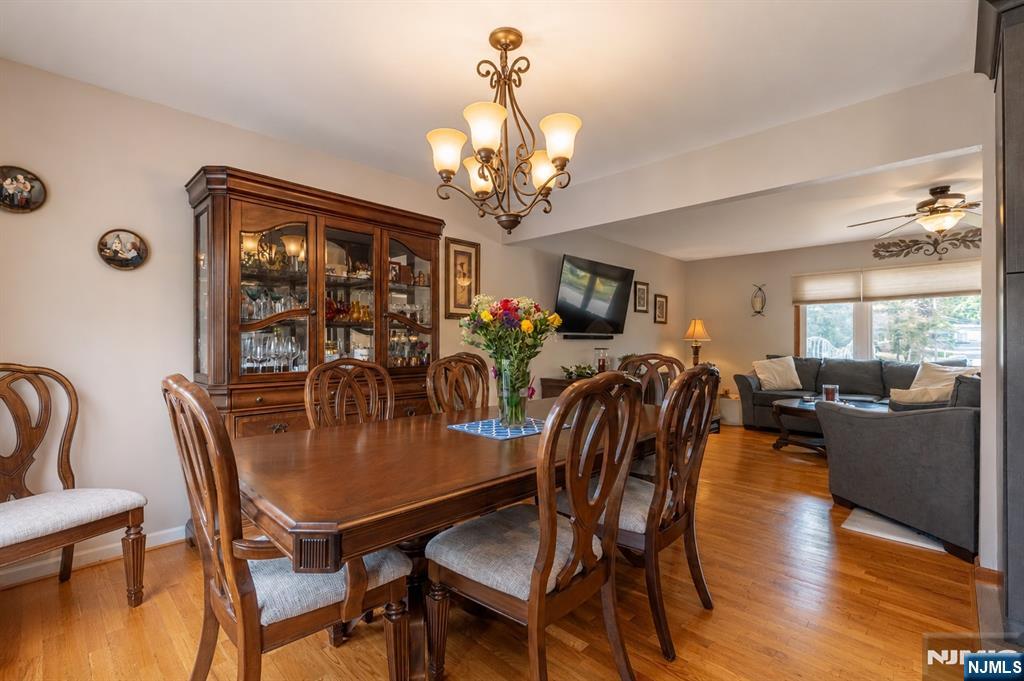 55 Marcia Road Ringwood, NJ 07456 - Photo 13 of 42 a view of a dining room with furniture window and wooden floor