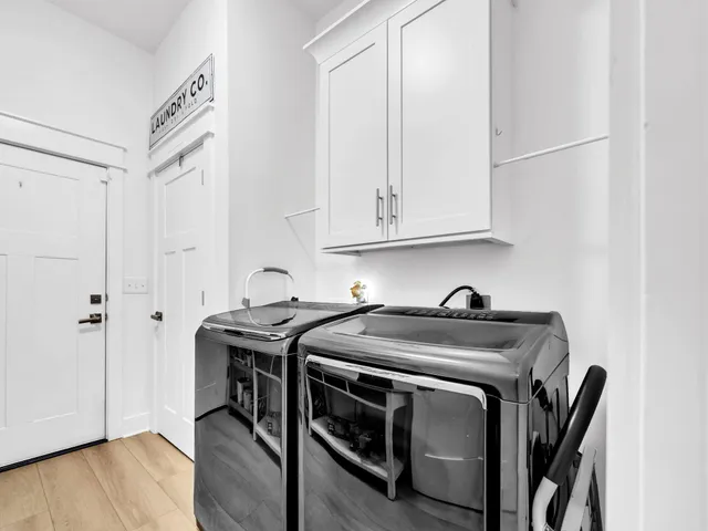 a view of a microwave and cabinets