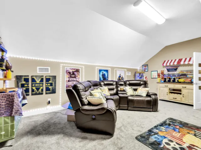 a living room with furniture fireplace and rug