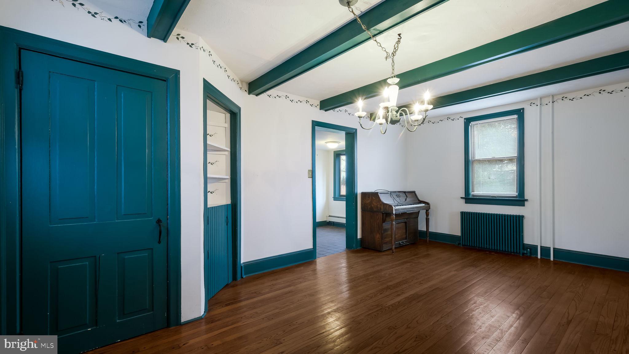 209 Old Bethlehem Road Perkasie, PA 18944 - Photo 11 of 23 a view of an empty room with window and wooden floor
