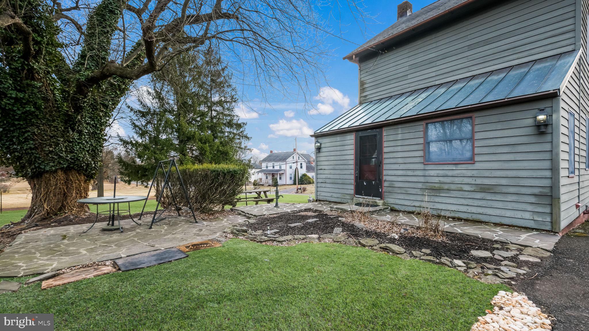 209 Old Bethlehem Road Perkasie, PA 18944 - Photo 3 of 23 a backyard of a house with lots of green space