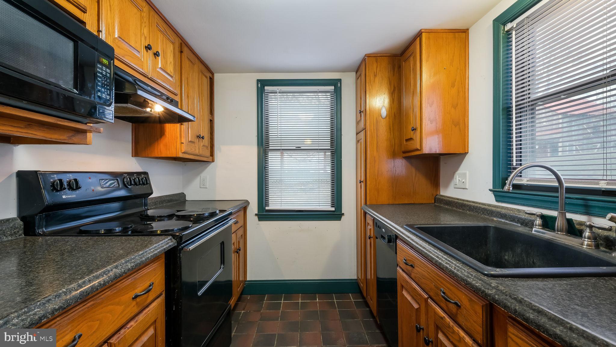 209 Old Bethlehem Road Perkasie, PA 18944 - Photo 8 of 23 a kitchen that has a sink and a stove