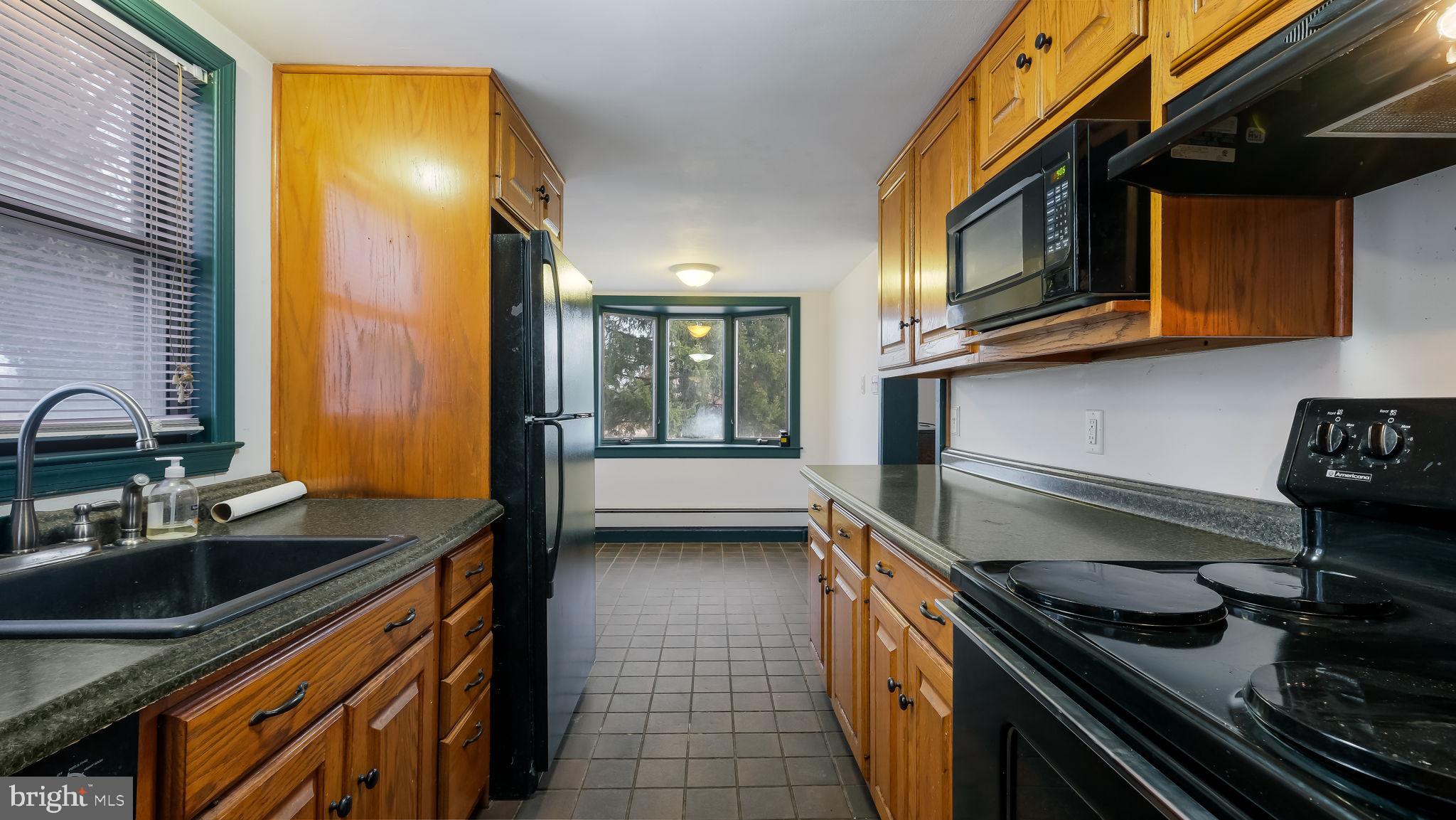 209 Old Bethlehem Road Perkasie, PA 18944 - Photo 9 of 23 a kitchen that has a sink and a stove