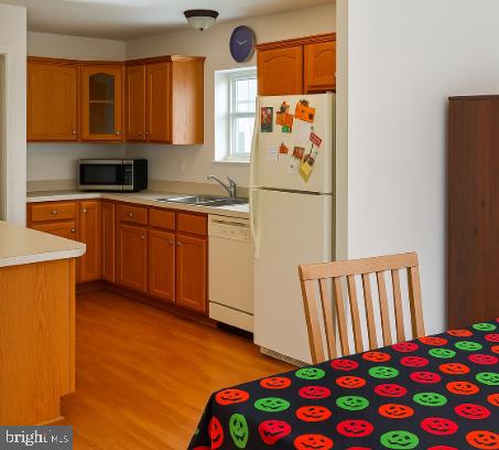 3290 Hartly Road Hartly, DE 19953 - Photo 4 of 13 a kitchen with stainless steel appliances granite countertop a refrigerator and a sink