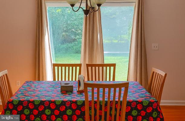 3290 Hartly Road Hartly, DE 19953 - Photo 5 of 13 a bedroom with a bed and wooden floor
