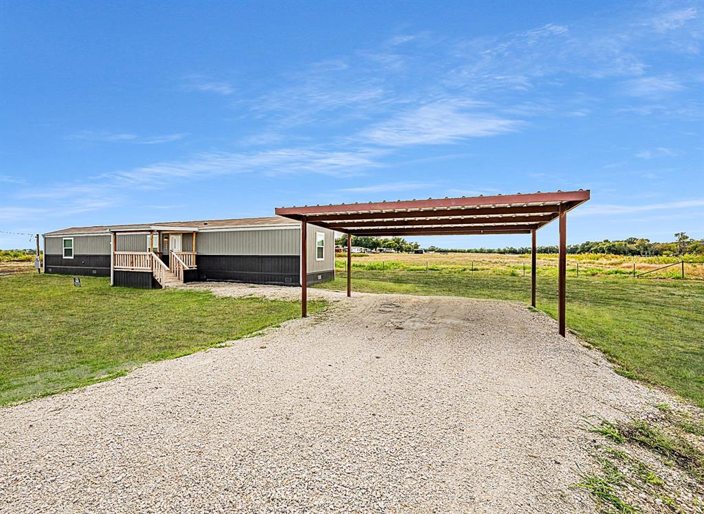 1206 Hayes Road Sherman, TX 75090 - Photo 3 of 21 a view of a garden with lawn chairs