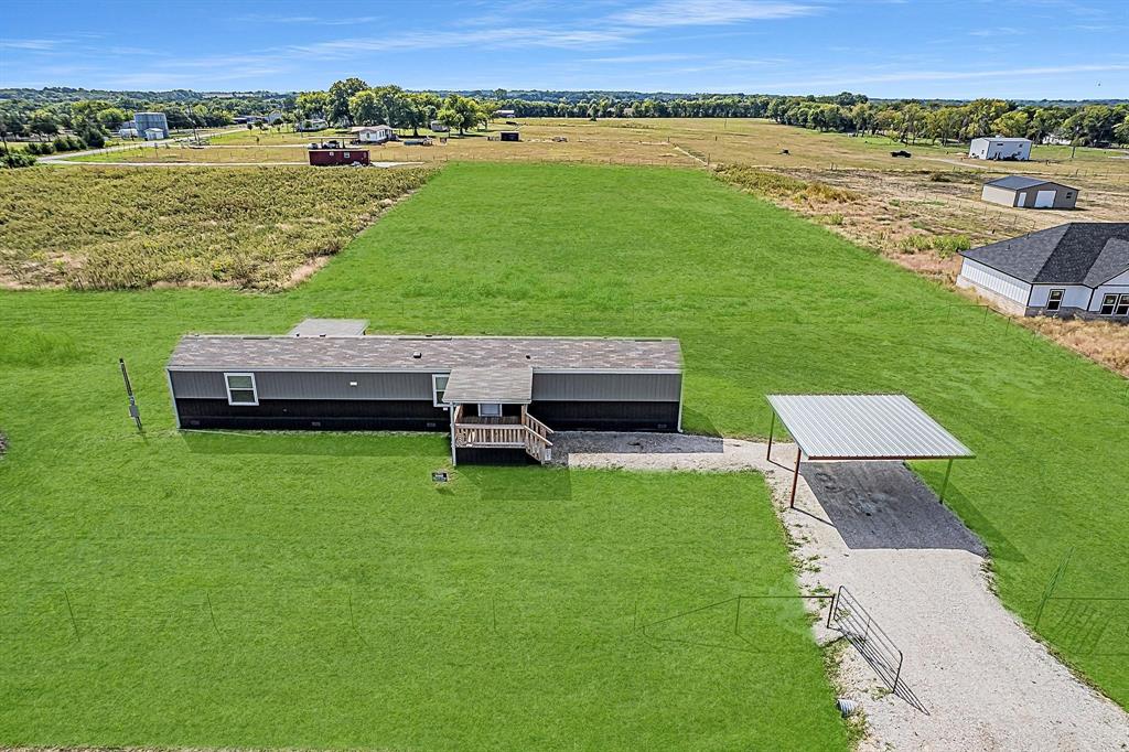 1206 Hayes Road Sherman, TX 75090 - Photo 4 of 21 a view of a lake with a yard and lake view