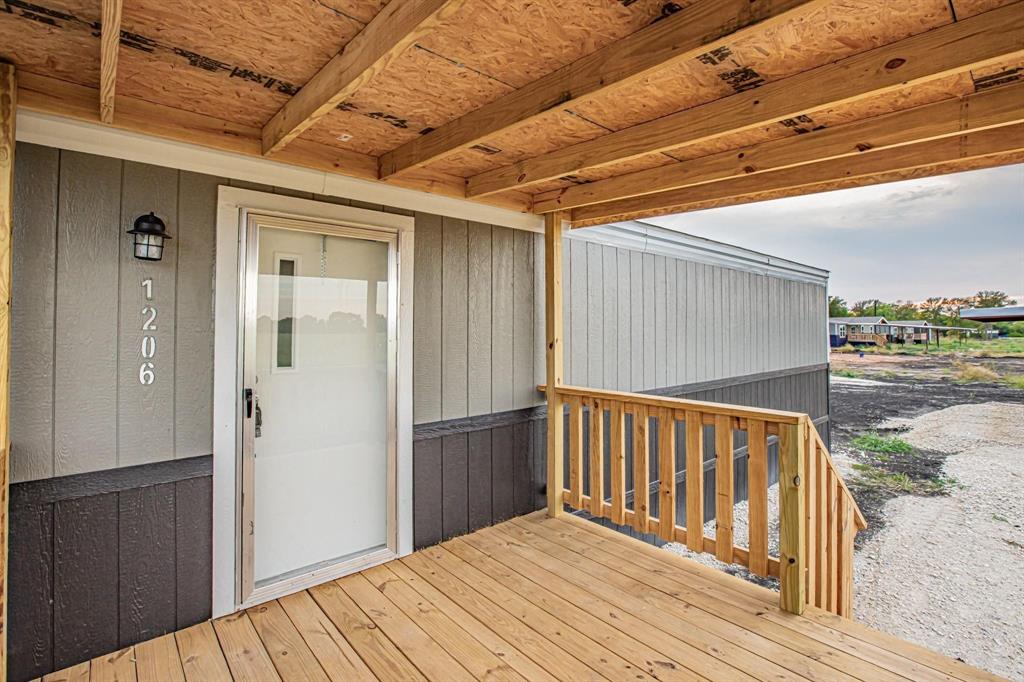 1206 Hayes Road Sherman, TX 75090 - Photo 6 of 21 a view of a wooden door