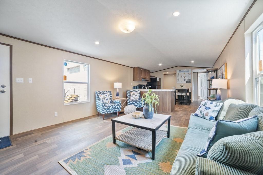 1206 Hayes Road Sherman, TX 75090 - Photo 10 of 21 a living room with furniture and a table