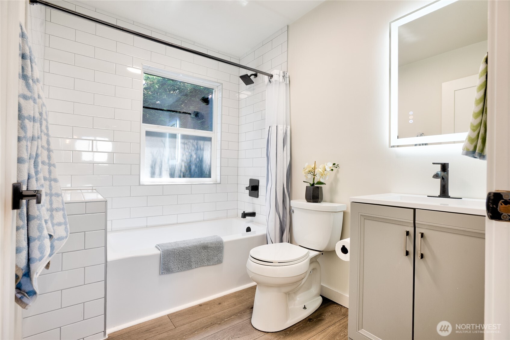 10059 8th Avenue Southwest Seattle, WA 98146 - Photo 11 of 24 a bathroom with a toilet sink and shower