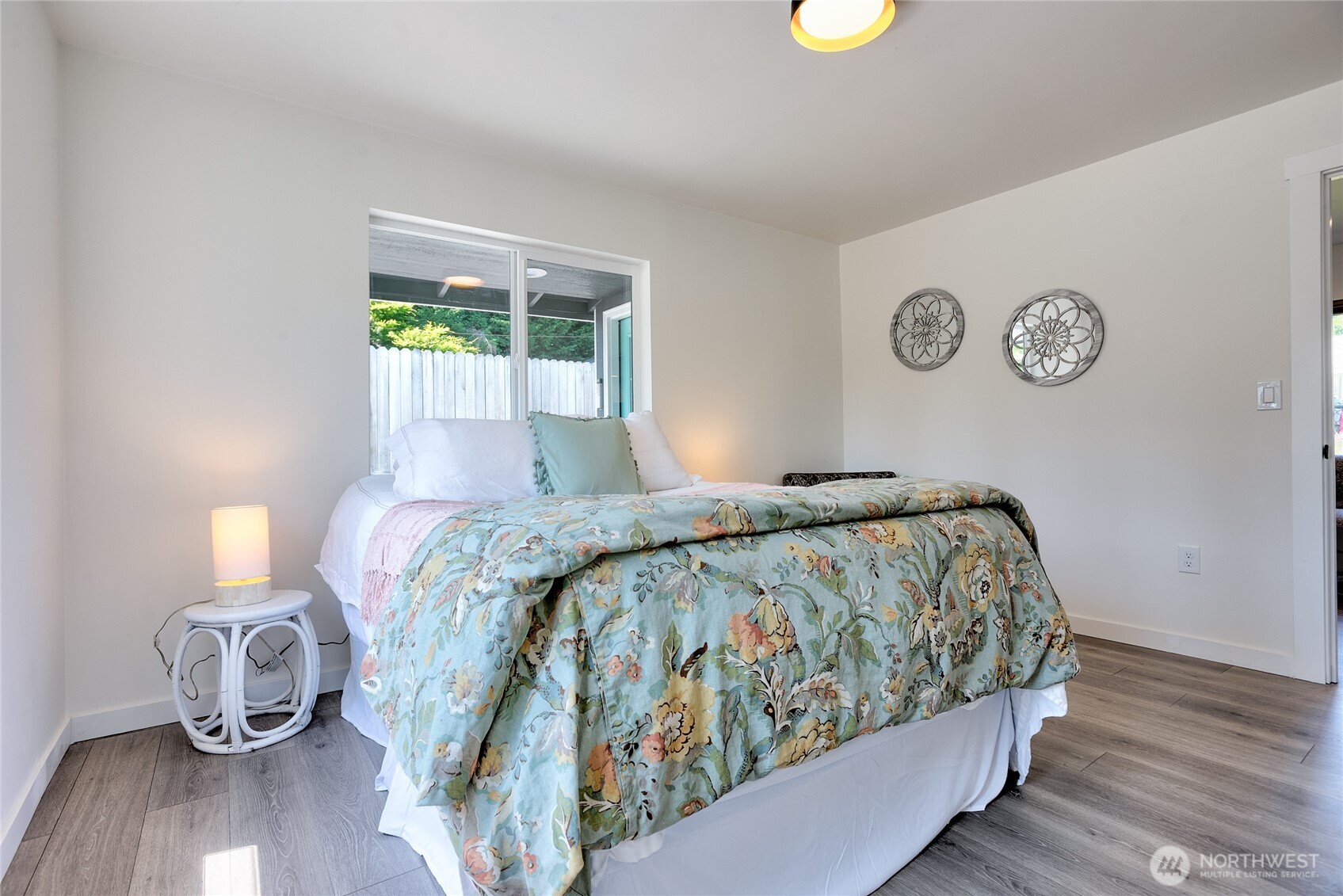 10059 8th Avenue Southwest Seattle, WA 98146 - Photo 13 of 24 a bedroom with a bed and a window