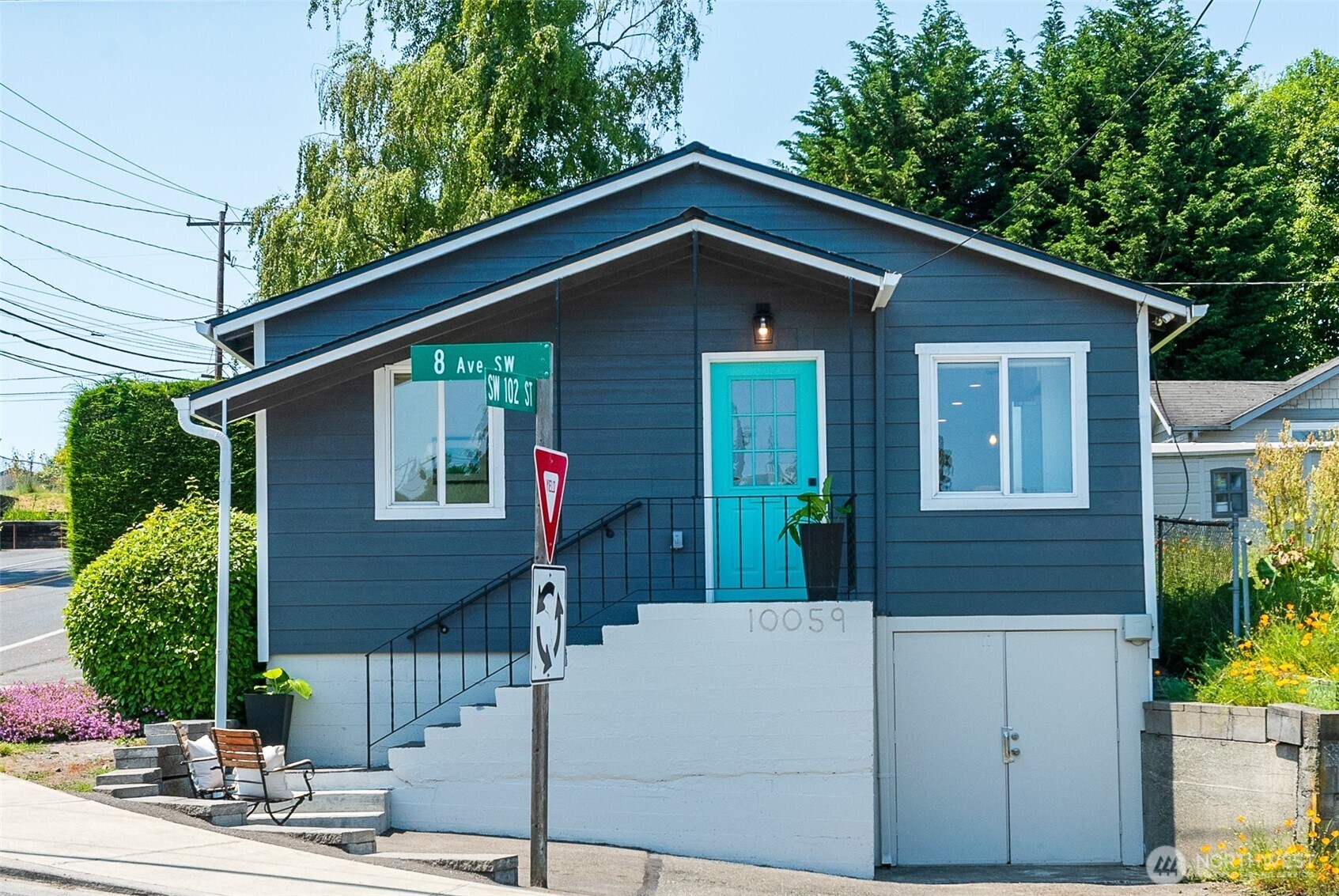 10059 8th Avenue Southwest Seattle, WA 98146 - Photo 2 of 24 a front view of a house with a yard