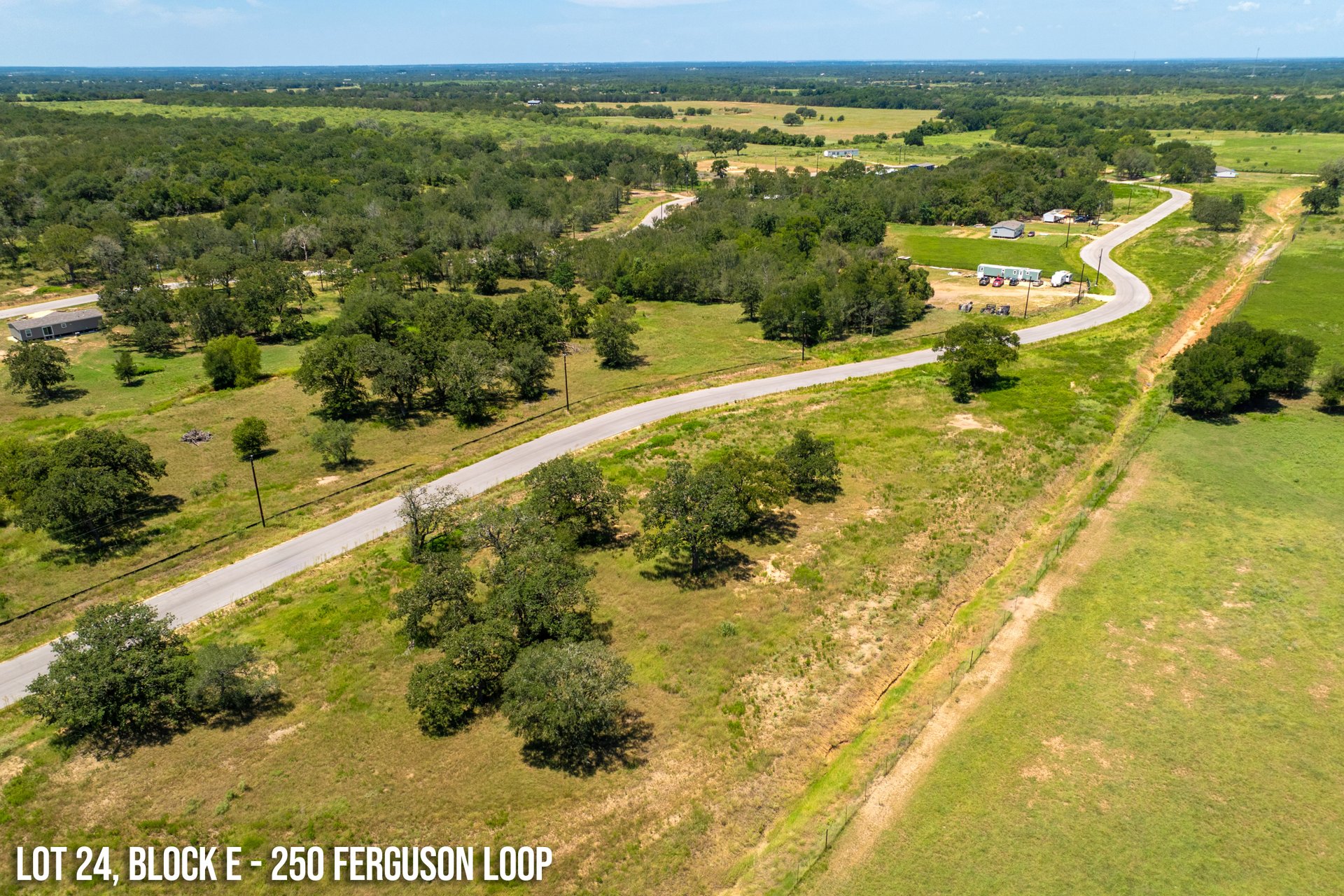 250 Ferguson Loop Dale Dale, TX 78616 - Photo 8 of 10 a view of a lake with a houses