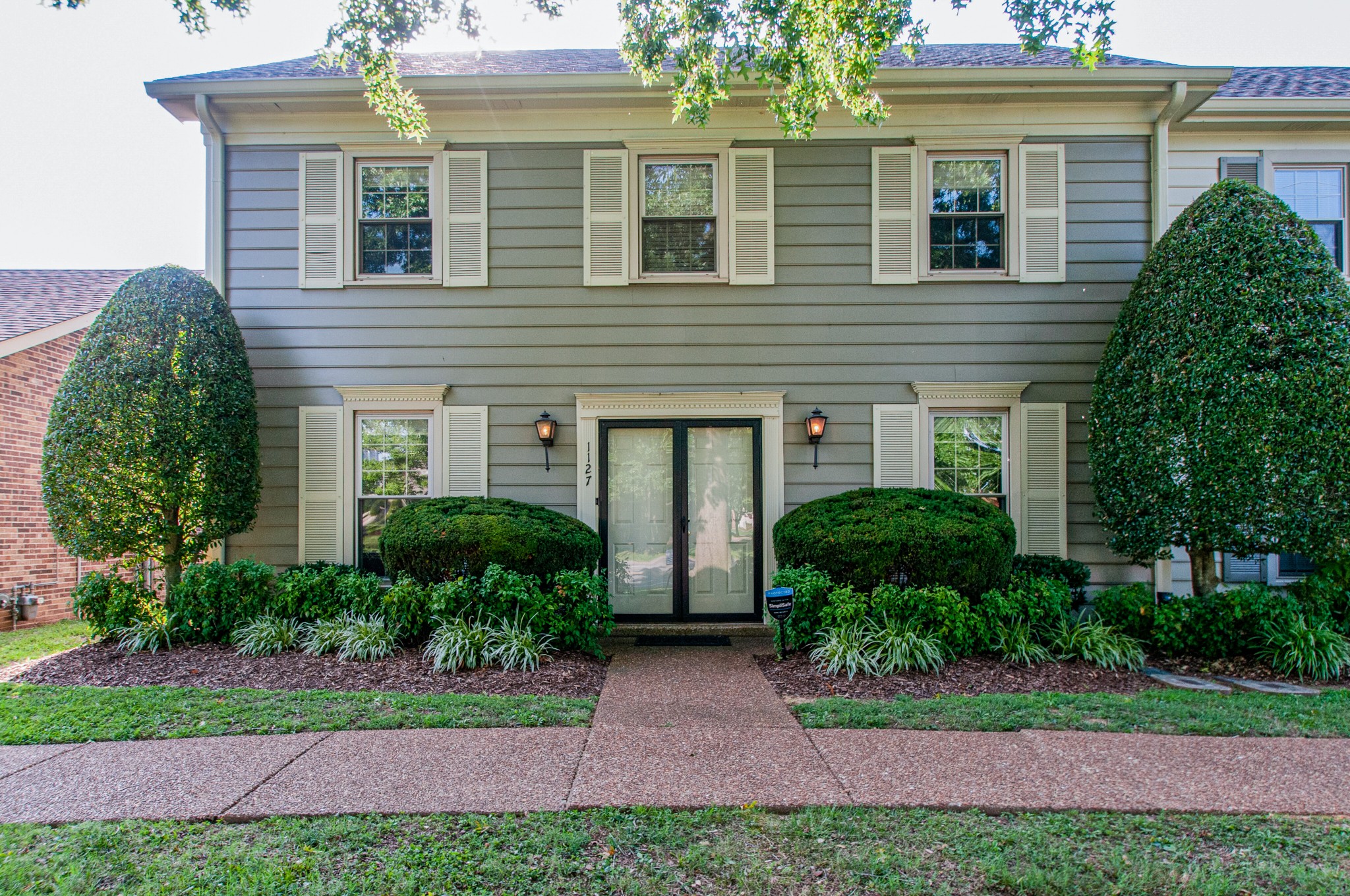 1127 General George Patton Road Nashville, TN 37221 - Photo 1 of 30 a front view of a house with a yard