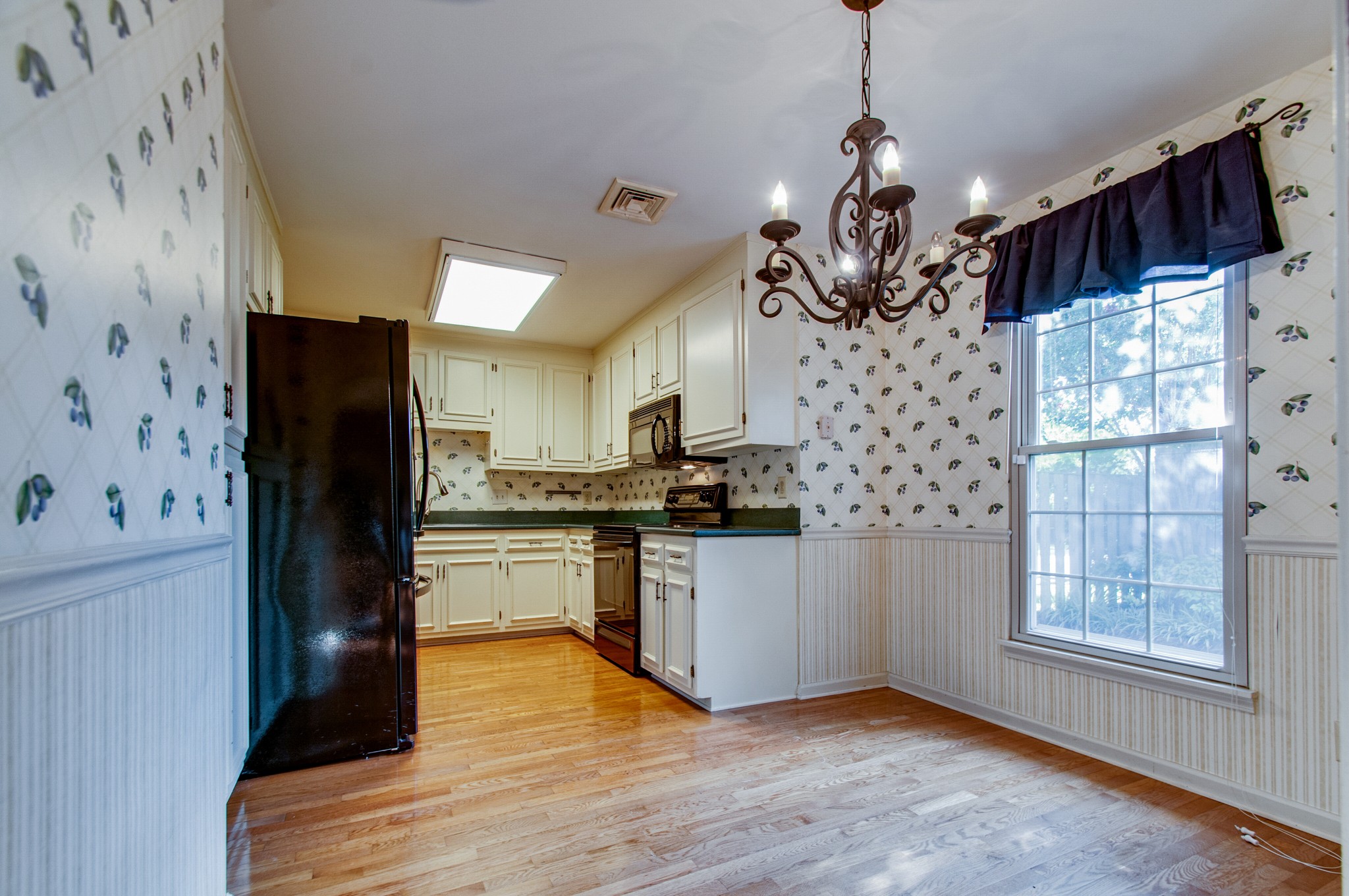 1127 General George Patton Road Nashville, TN 37221 - Photo 13 of 30 a kitchen with stainless steel appliances granite countertop a refrigerator and a stove top oven