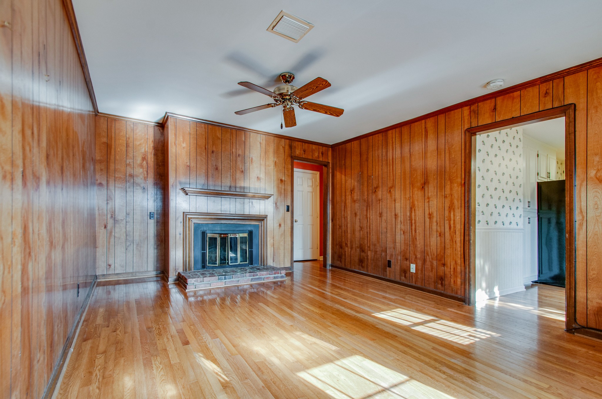1127 General George Patton Road Nashville, TN 37221 - Photo 16 of 30 a view of a livingroom with a fireplace wooden floor and window