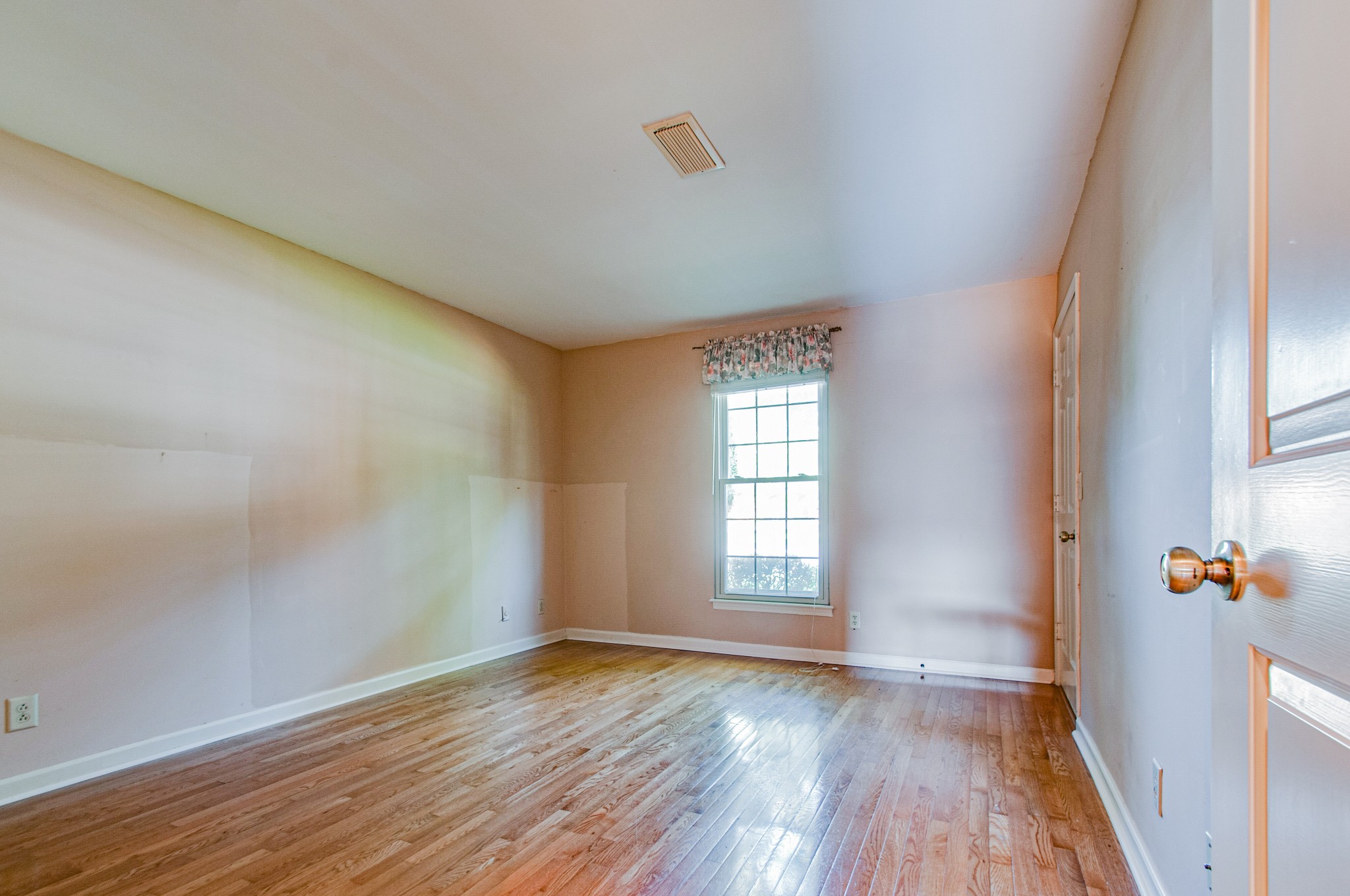 1127 General George Patton Road Nashville, TN 37221 - Photo 18 of 30 an empty room with wooden floor and windows