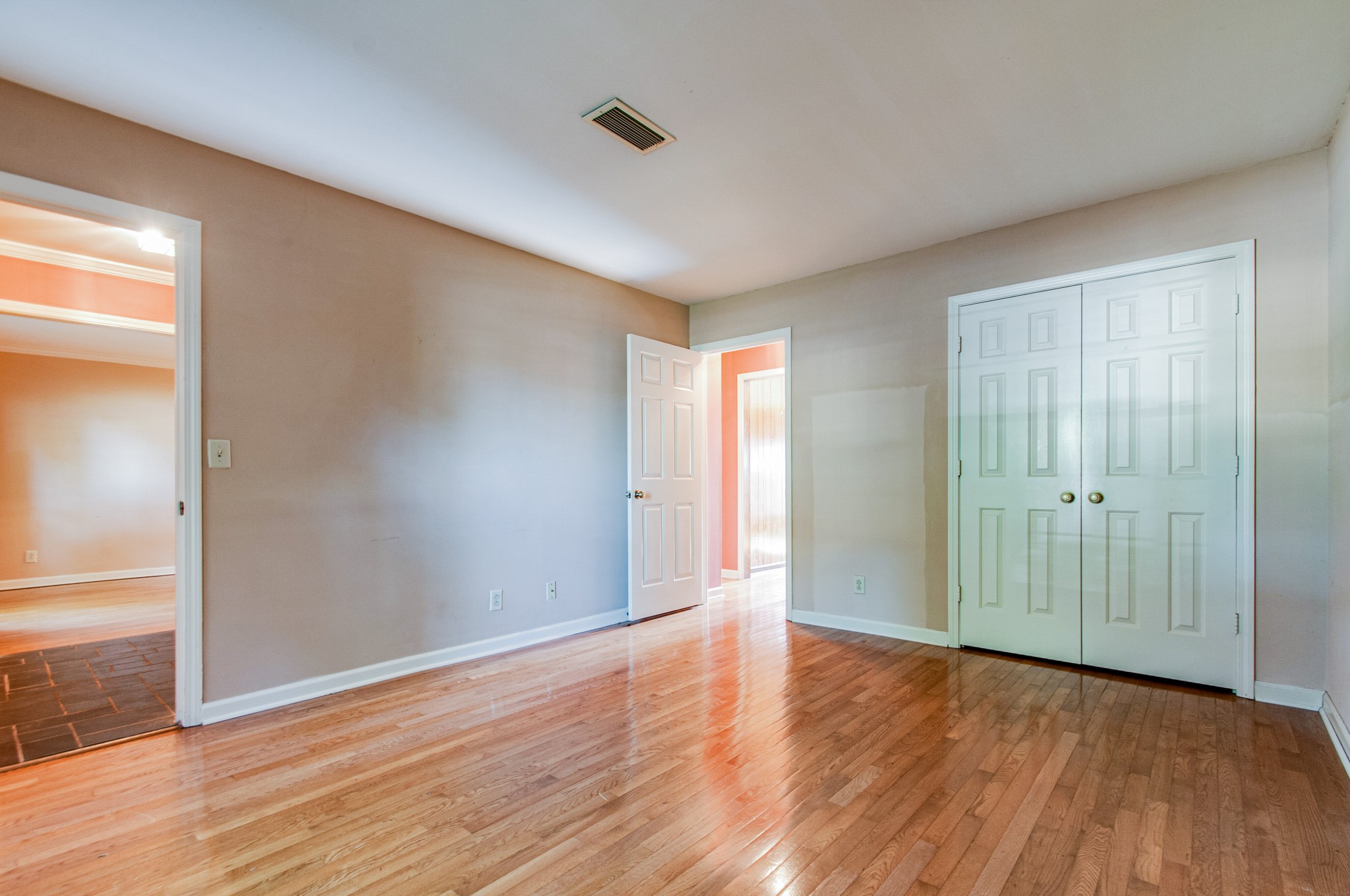 1127 General George Patton Road Nashville, TN 37221 - Photo 19 of 30 an empty room with wooden floor and windows