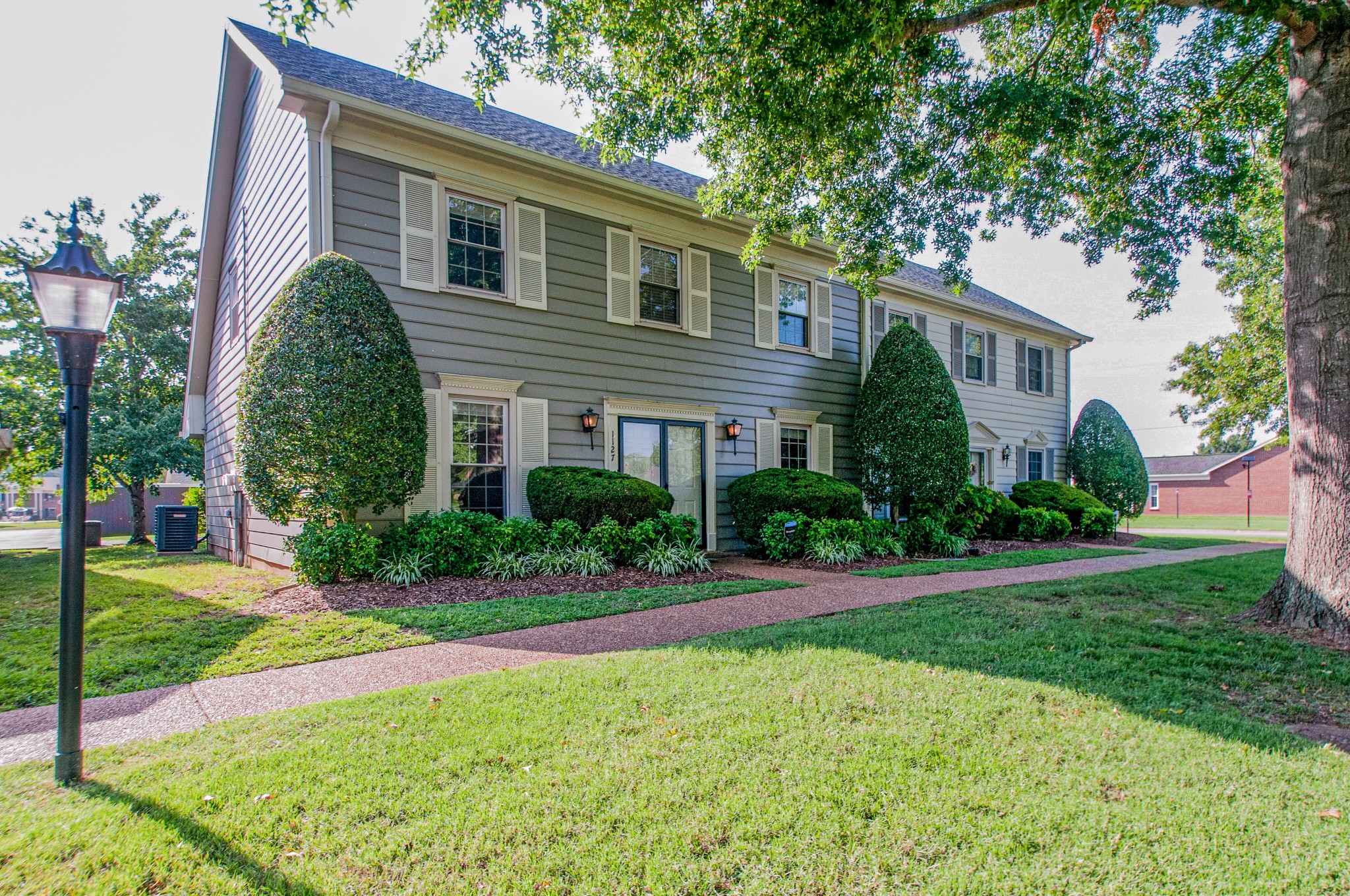 1127 General George Patton Road Nashville, TN 37221 - Photo 2 of 30 a front view of a house with a yard