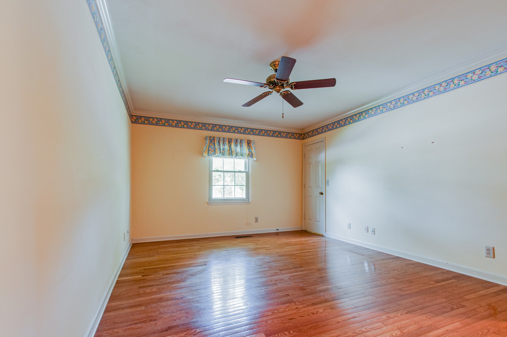 1127 General George Patton Road Nashville, TN 37221 - Photo 21 of 30 a view of empty room with wooden floor and fan