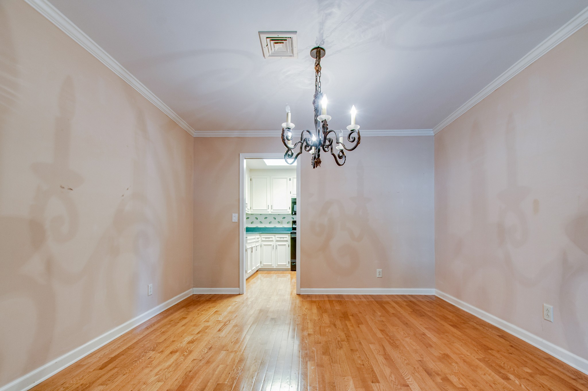 1127 General George Patton Road Nashville, TN 37221 - Photo 9 of 30 a view of a room with a chandelier and wooden floor