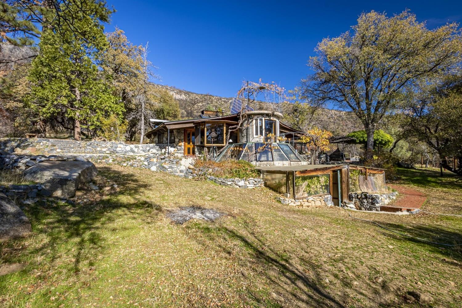32100 Kinsman Flat Road North Fork, CA 93643 - Photo 1 of 62 a view of a house with a yard
