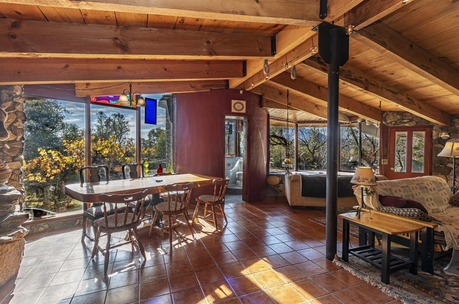 32100 Kinsman Flat Road North Fork, CA 93643 - Photo 12 of 62 a view of a patio with table and chairs potted plants with wooden floor