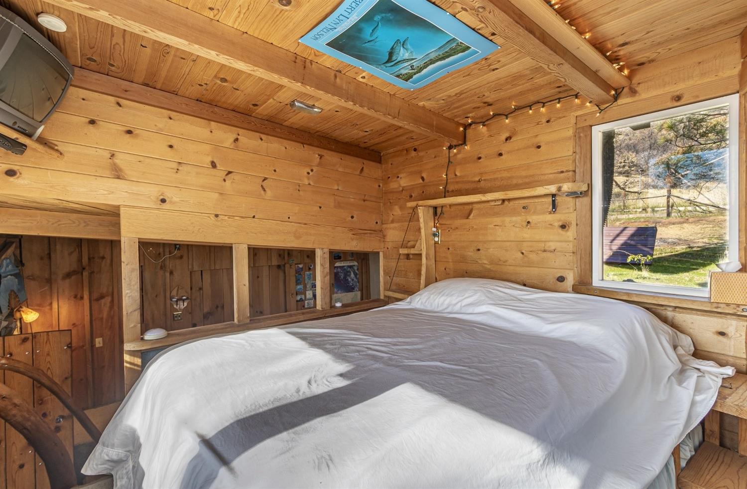 32100 Kinsman Flat Road North Fork, CA 93643 - Photo 18 of 62 a bedroom with a bed and a large window