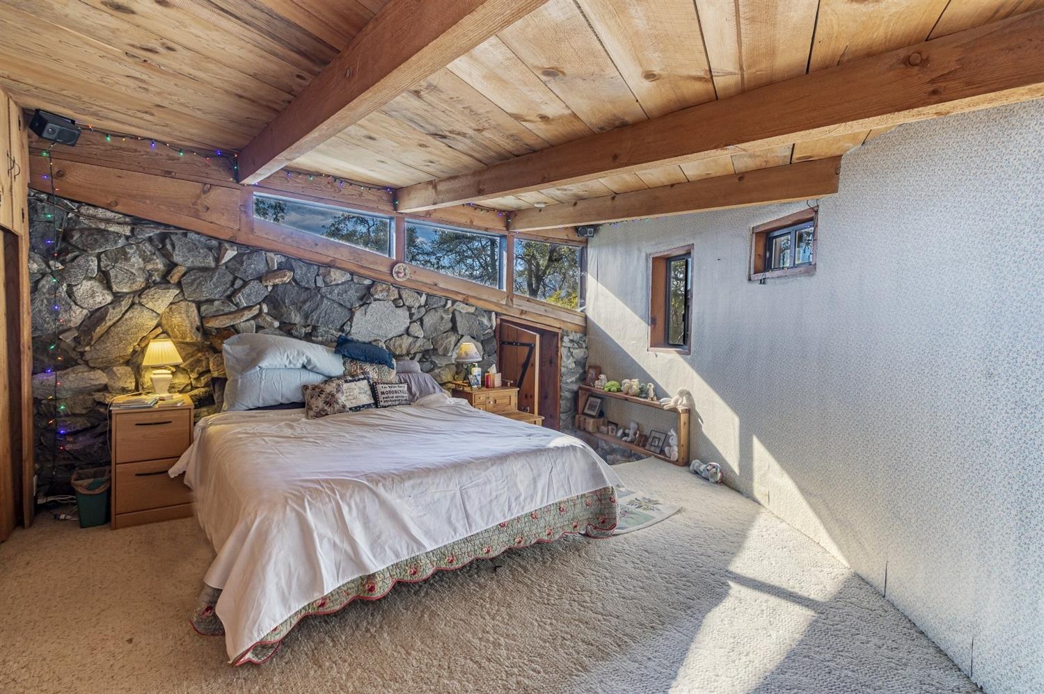 32100 Kinsman Flat Road North Fork, CA 93643 - Photo 21 of 62 a bedroom with bed and balcony