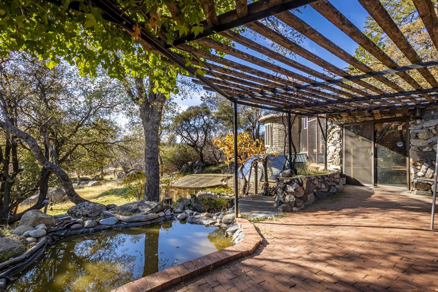 32100 Kinsman Flat Road North Fork, CA 93643 - Photo 22 of 62 a view of a chairs and table in the patio