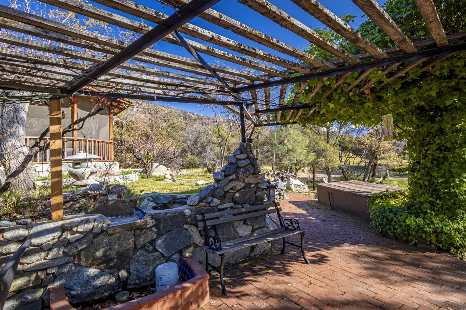32100 Kinsman Flat Road North Fork, CA 93643 - Photo 24 of 62 a view of a swimming pool with a patio